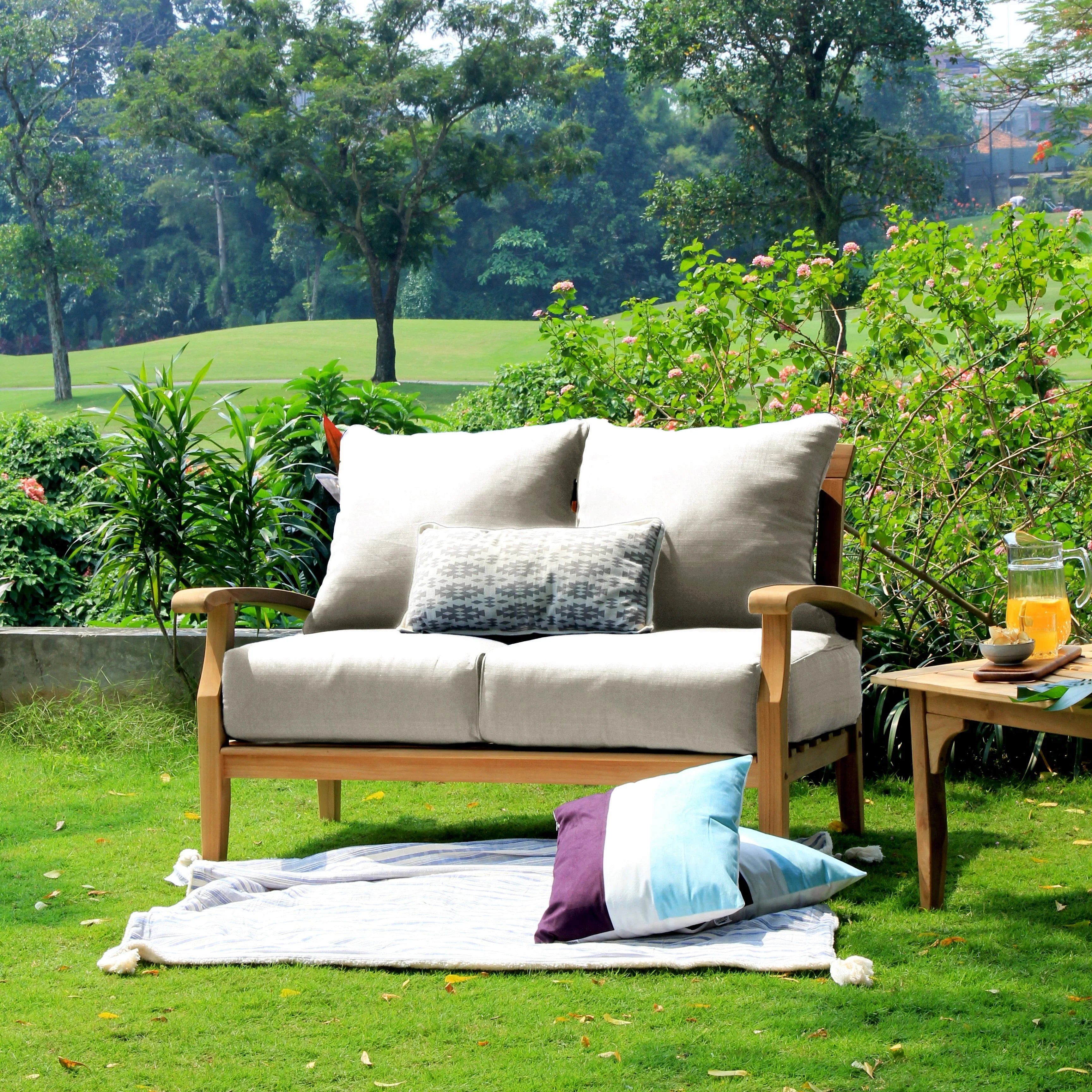 Cambridge Casual Leon Teak Patio Loveseat with Pillow Plantation Teak/Beige Pillow